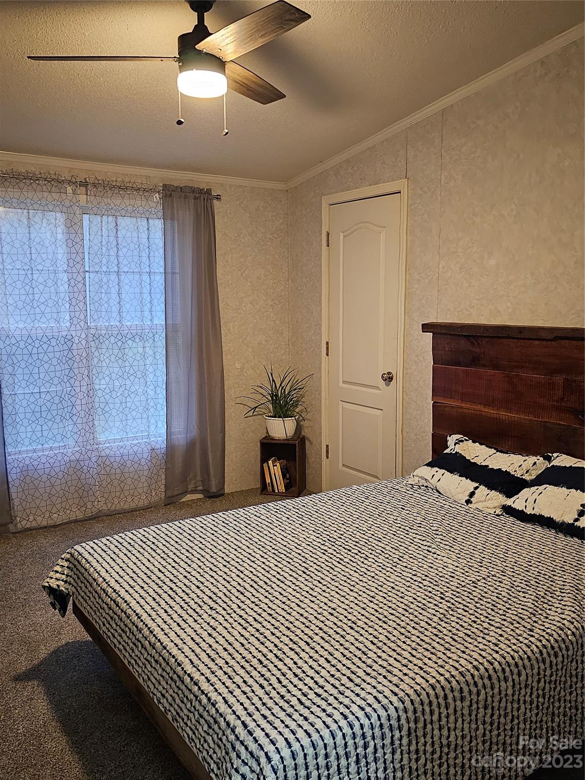 224 McDaniel Road Blacksburg, SC 29702 - Photo 16 of 20 a bedroom with a bed and wooden floor