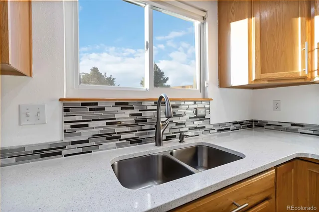 a kitchen with a sink and a window