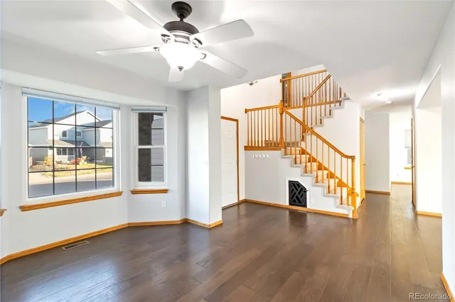 a view of an entryway with wooden floor