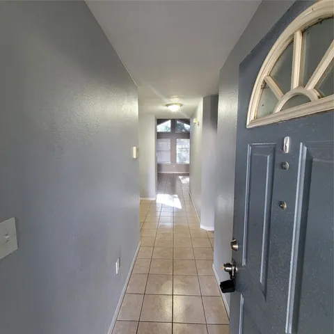 a bathroom with a glass door shower