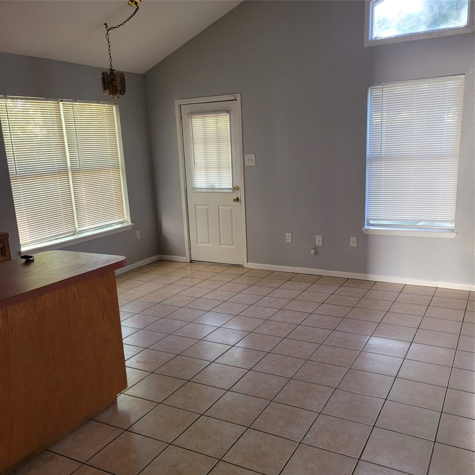 4508 15th Street Bacliff, TX 77518 - Photo 12 of 17 an empty room with windows and entrance