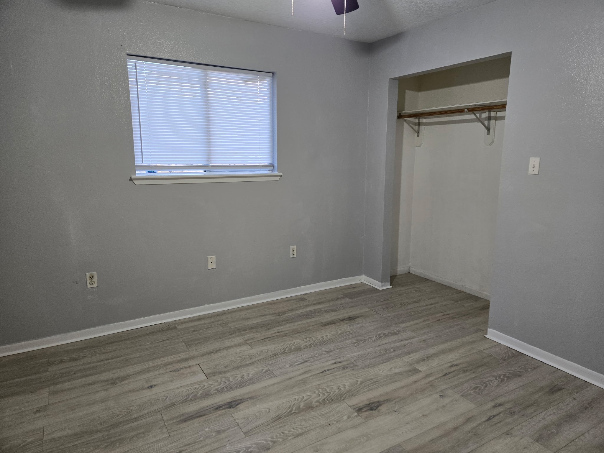 4508 15th Street Bacliff, TX 77518 - Photo 16 of 17 an empty room with wooden floor and windows