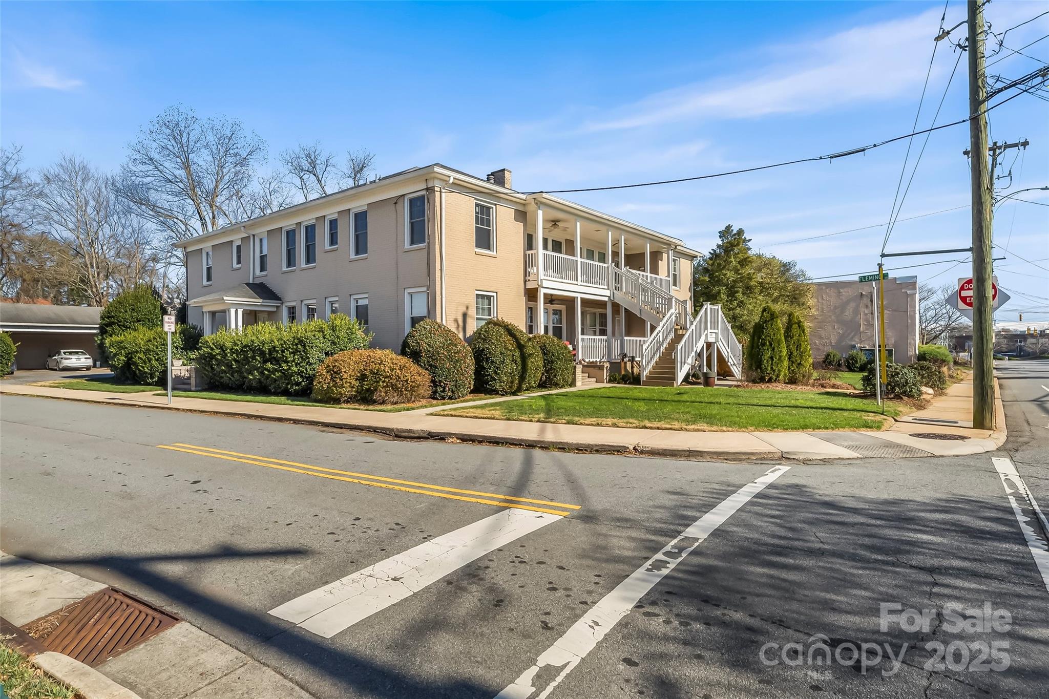 308 North Green Street, Unit 6 Morganton, NC 28655 - Photo 18 of 21 a view of a white house with a yard