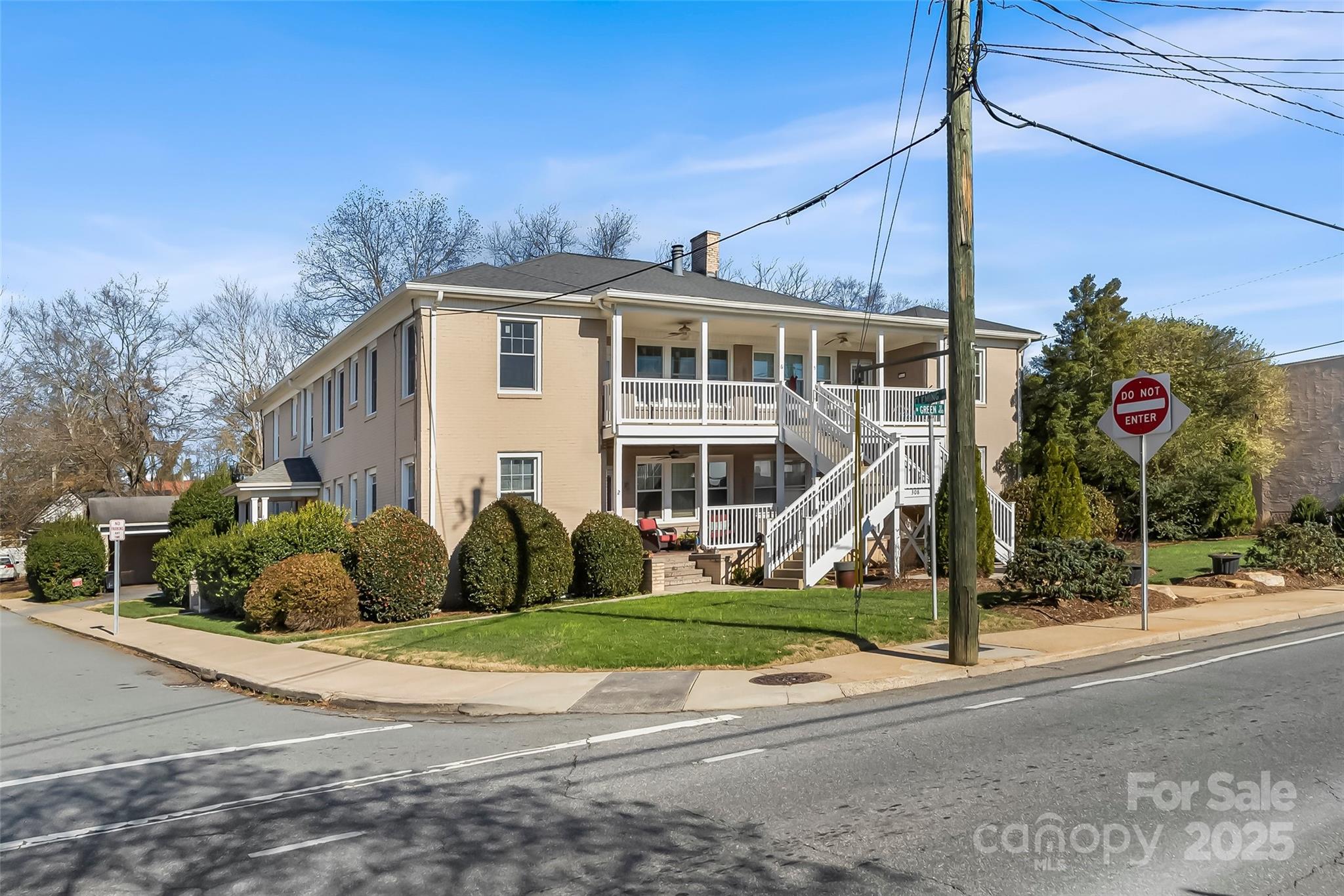 308 North Green Street, Unit 6 Morganton, NC 28655 - Photo 19 of 21 a view of a house next to a yard