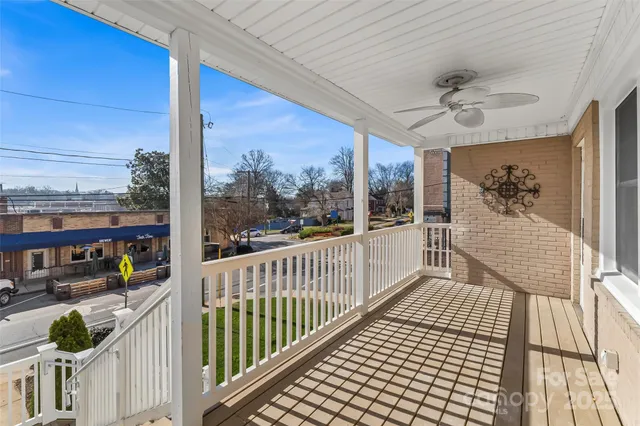 a view of a balcony with furniture