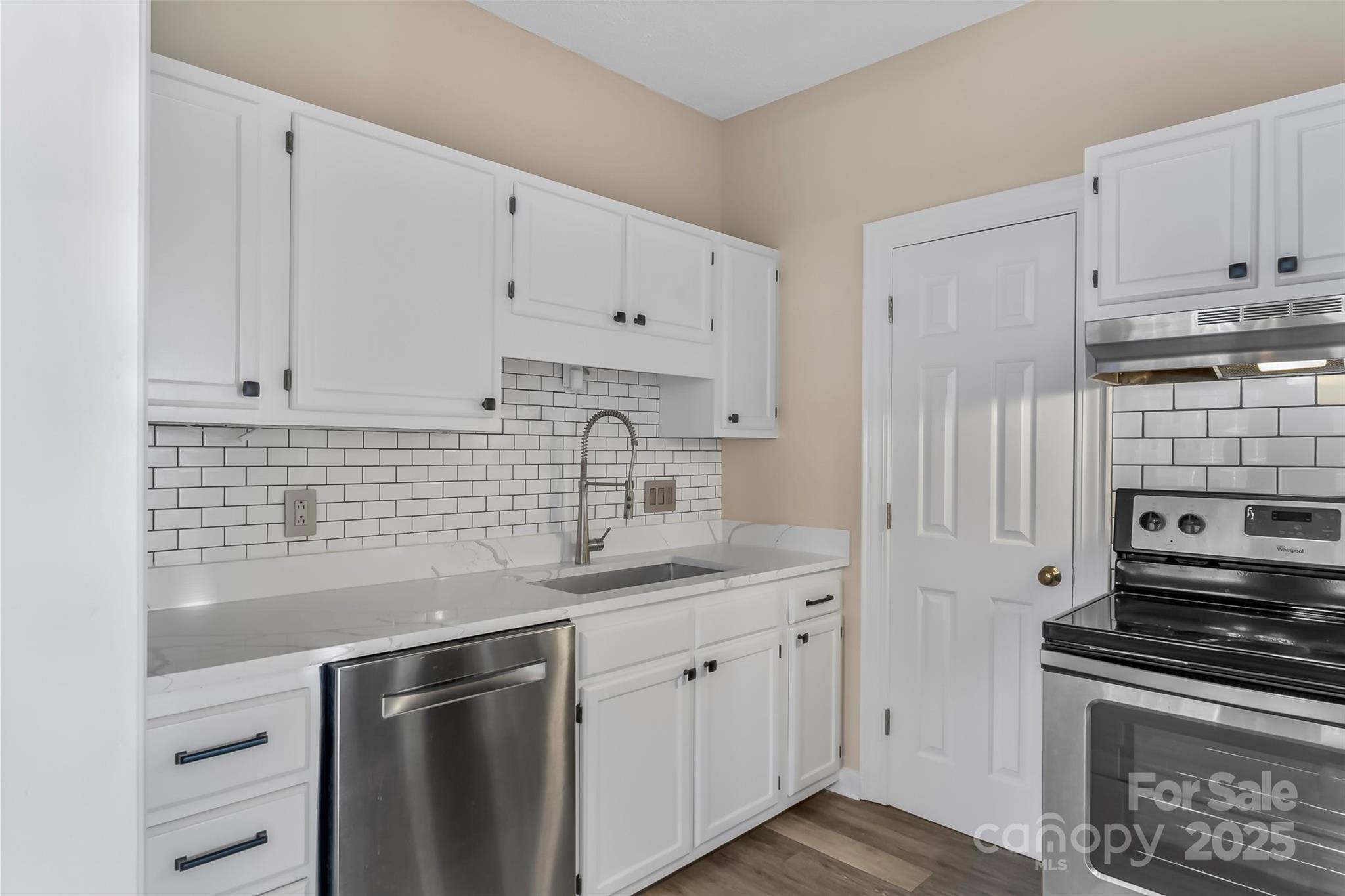 308 North Green Street, Unit 6 Morganton, NC 28655 - Photo 8 of 21 a kitchen with appliances a sink and cabinets