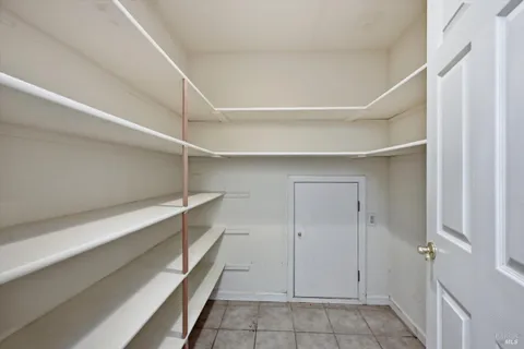 a view of empty room with floor to ceiling window