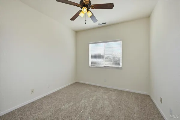 a bathroom with a sink a toilet and shower curtain