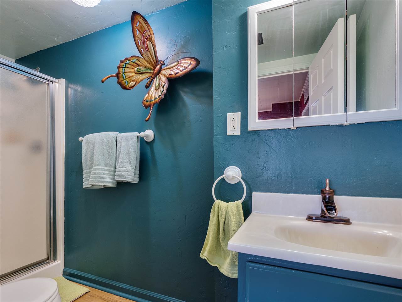 1966 K Road Fruita, CO 81521 - Photo 24 of 40 a bathroom with a sink a mirror and vanity