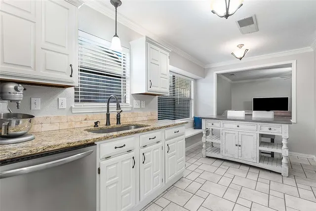 a bathroom with a granite countertop sink a toilet and a mirror