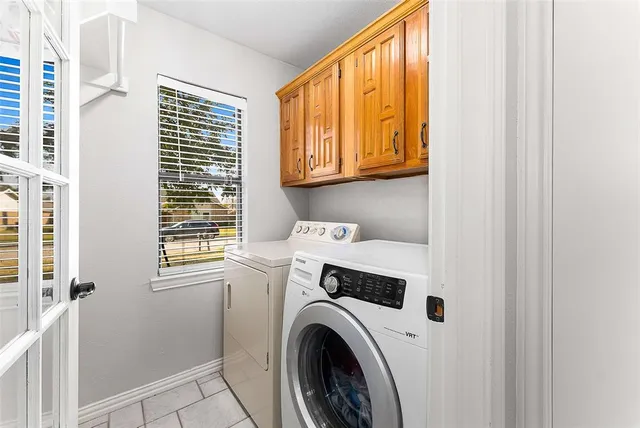 a view of a kitchen with washer and dryer