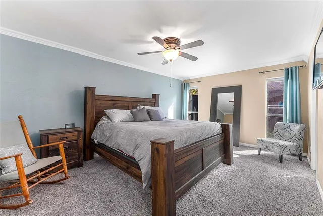 a bed room with a bed and a chair