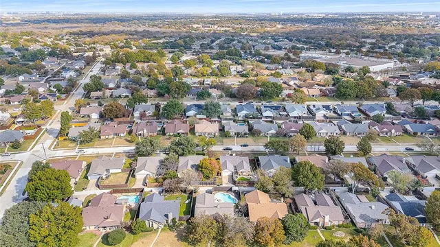 an aerial view of residential building with green space