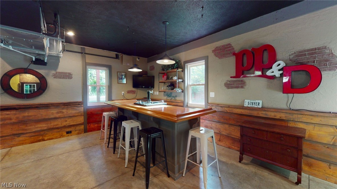 6556 Stone Road Hudson, OH 44236 - Photo 31 of 35 The man cave has detailed rustic walls and wood shiplap boards