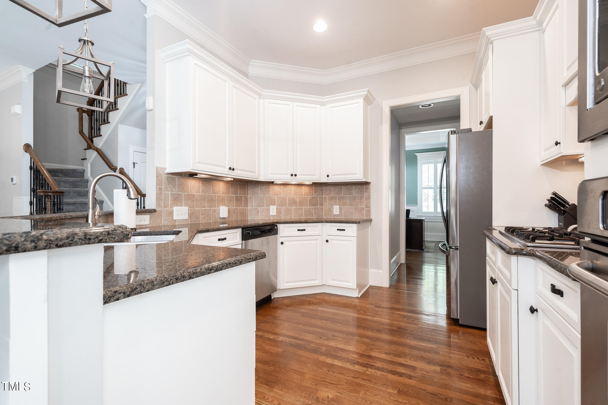 1700 Rainbow Hill Raleigh, NC 27614 - Photo 11 of 35 a kitchen with granite countertop a sink stove and refrigerator