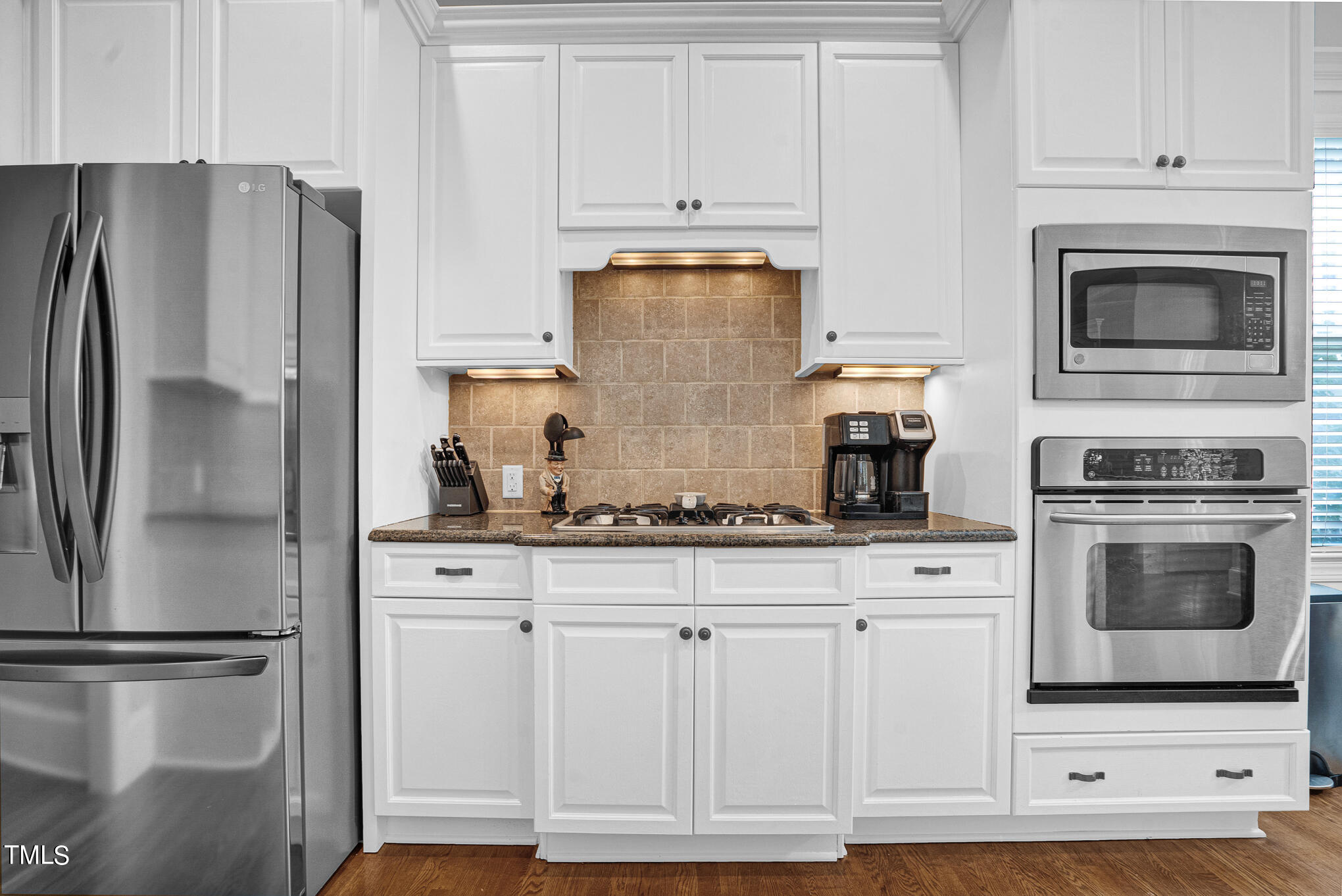 1700 Rainbow Hill Raleigh, NC 27614 - Photo 12 of 35 a kitchen with granite countertop white cabinets and stainless steel appliances