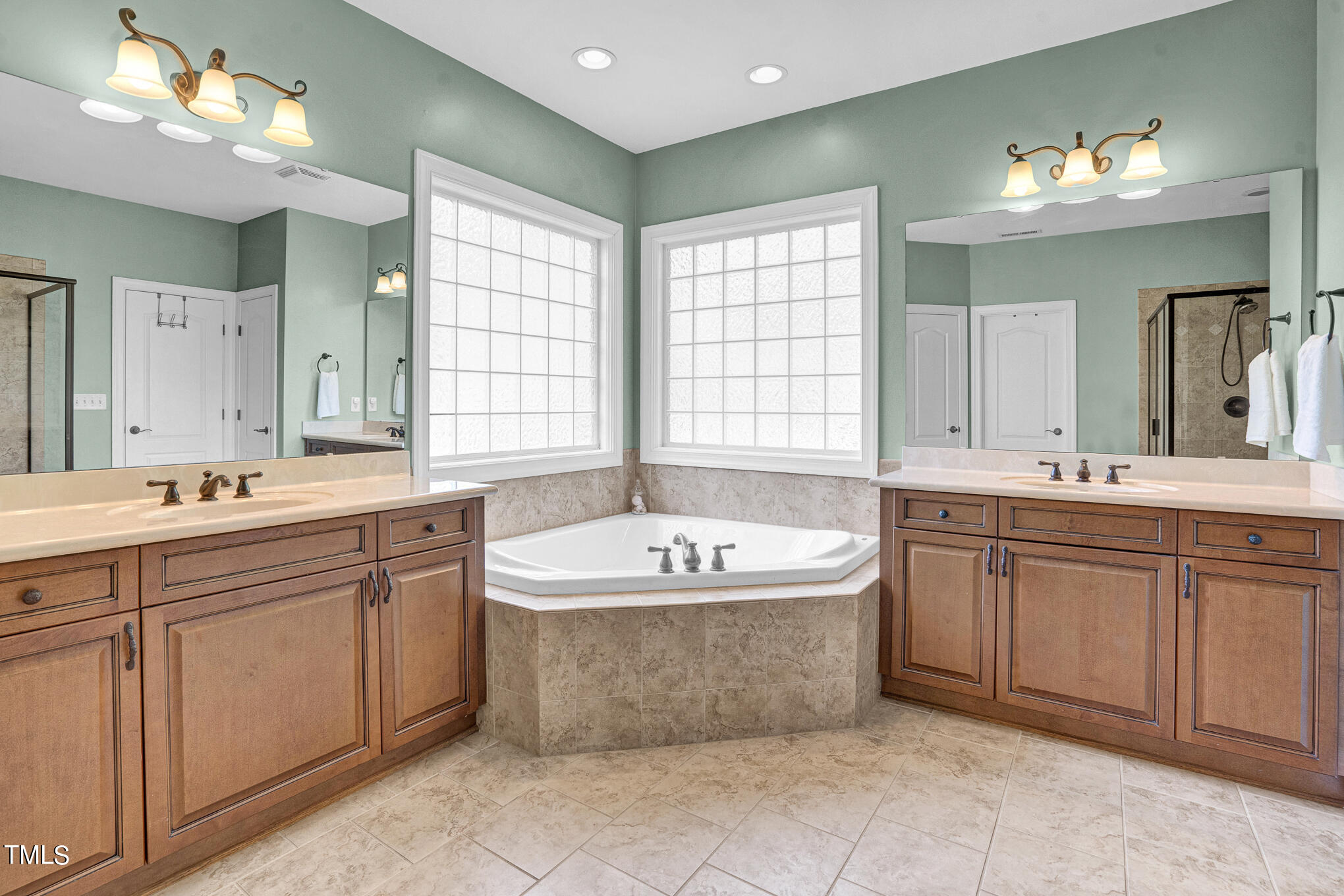 1700 Rainbow Hill Raleigh, NC 27614 - Photo 18 of 35 a spacious bathroom with a tub sink and mirror