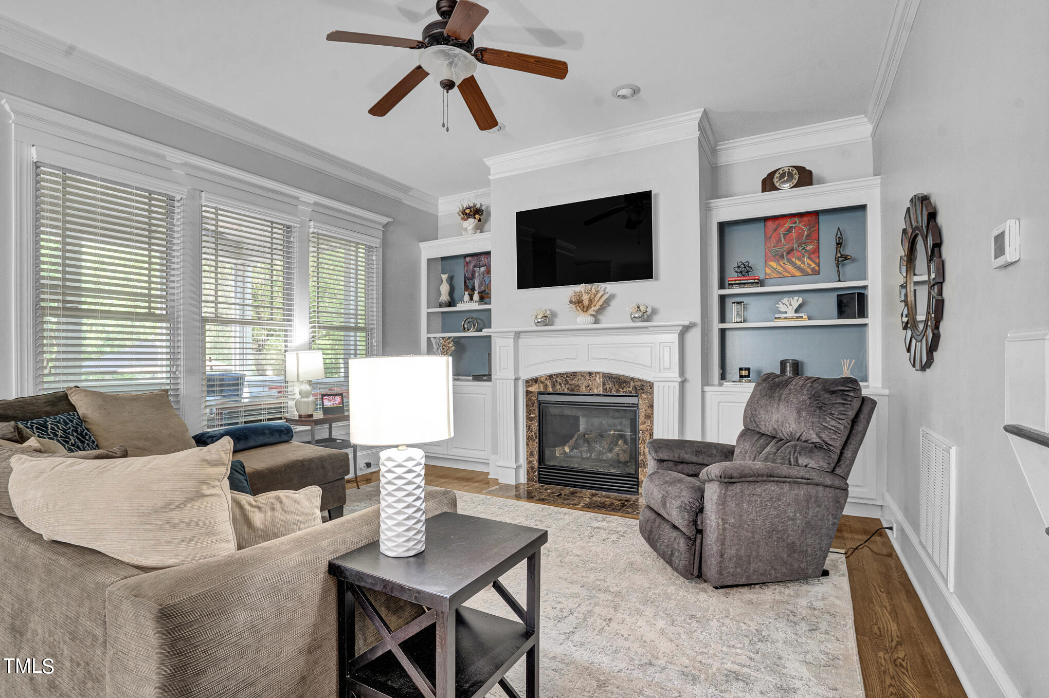 1700 Rainbow Hill Raleigh, NC 27614 - Photo 7 of 35 a living room with furniture fireplace and a flat screen tv