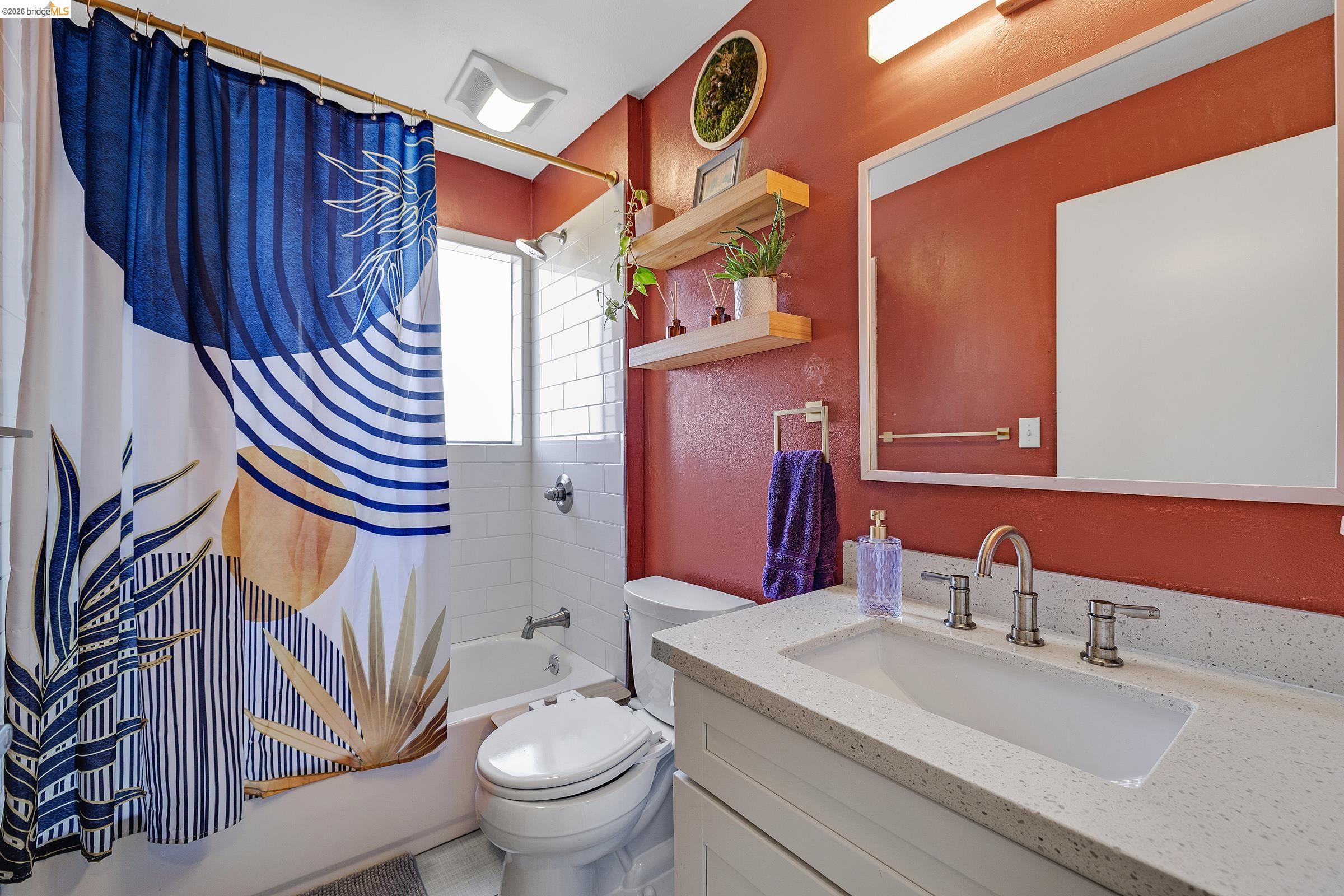 407 Vista Heights Road El Cerrito, CA 94530 - Photo 14 of 29 Bathroom featuring vanity and shower / bathtub combination with curtain