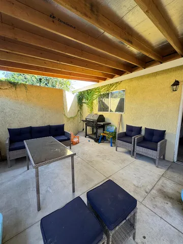a living room with furniture and a rug