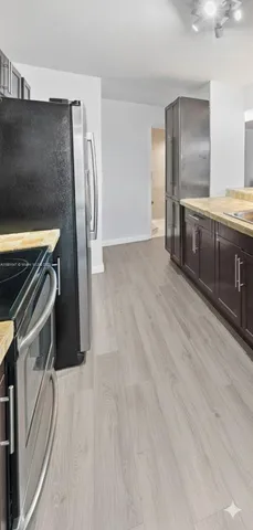 a view of a kitchen with a sink