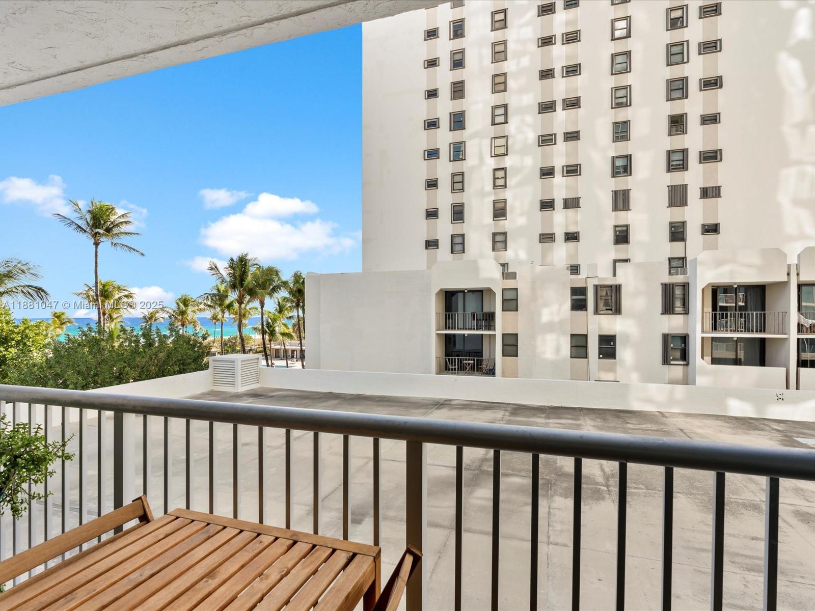 2655 Collins Avenue, Unit 510 Miami Beach, FL 33140 - Photo 20 of 23 a view of a balcony with potted plants