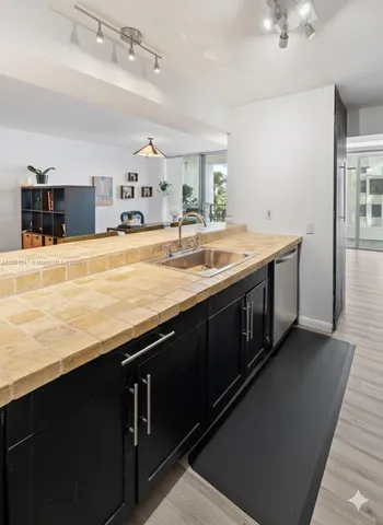 a spacious bathroom with a sink and a large mirror