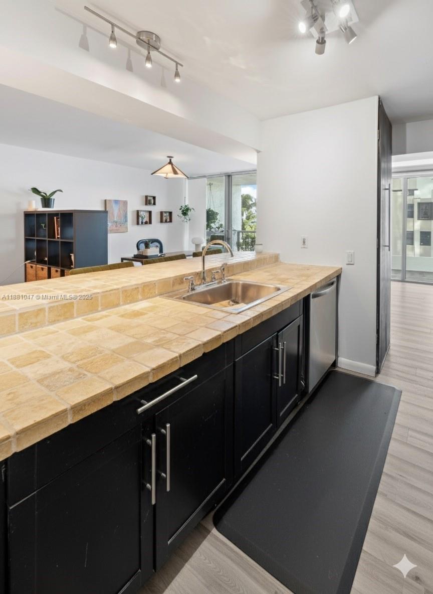 2655 Collins Avenue, Unit 510 Miami Beach, FL 33140 - Photo 10 of 23 a spacious bathroom with a sink and a large mirror