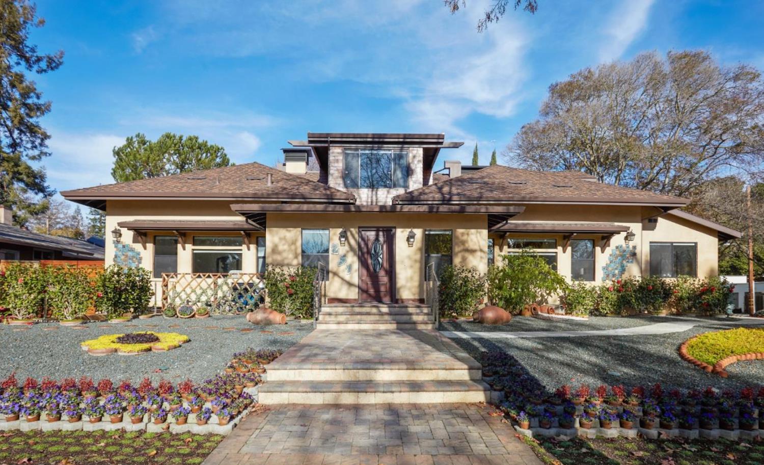 a front view of a house with a yard