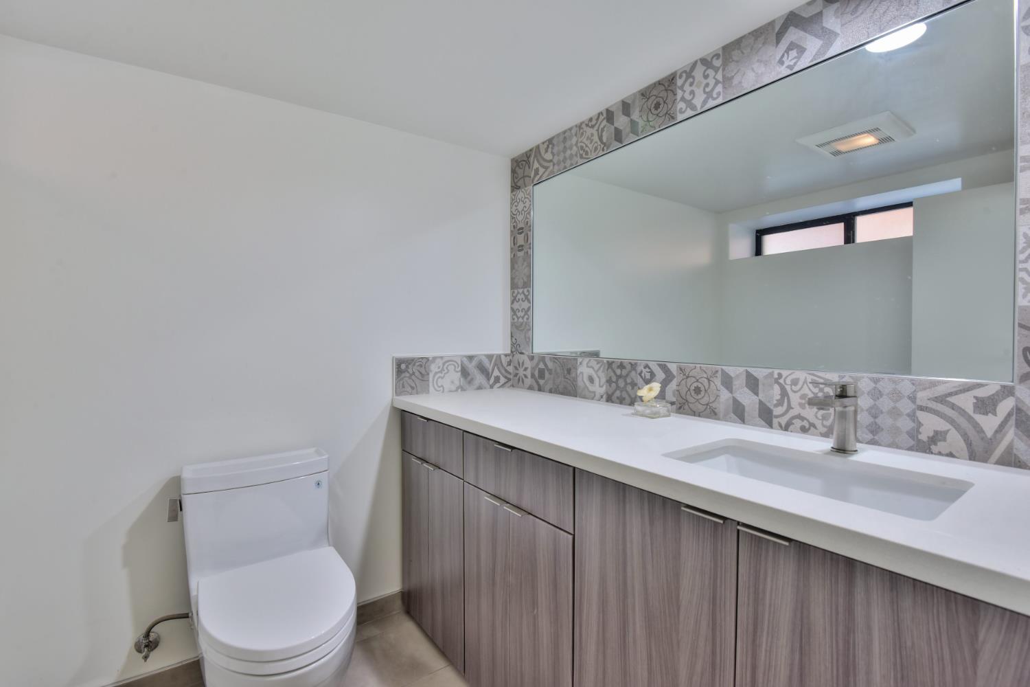 251 Middlefield Road Palo Alto, CA 94301 - Photo 18 of 76 a bathroom with a sink and a toilet