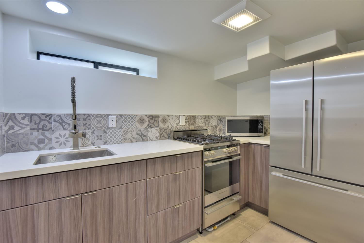 251 Middlefield Road Palo Alto, CA 94301 - Photo 20 of 76 a kitchen with stainless steel appliances granite countertop a sink stove and refrigerator
