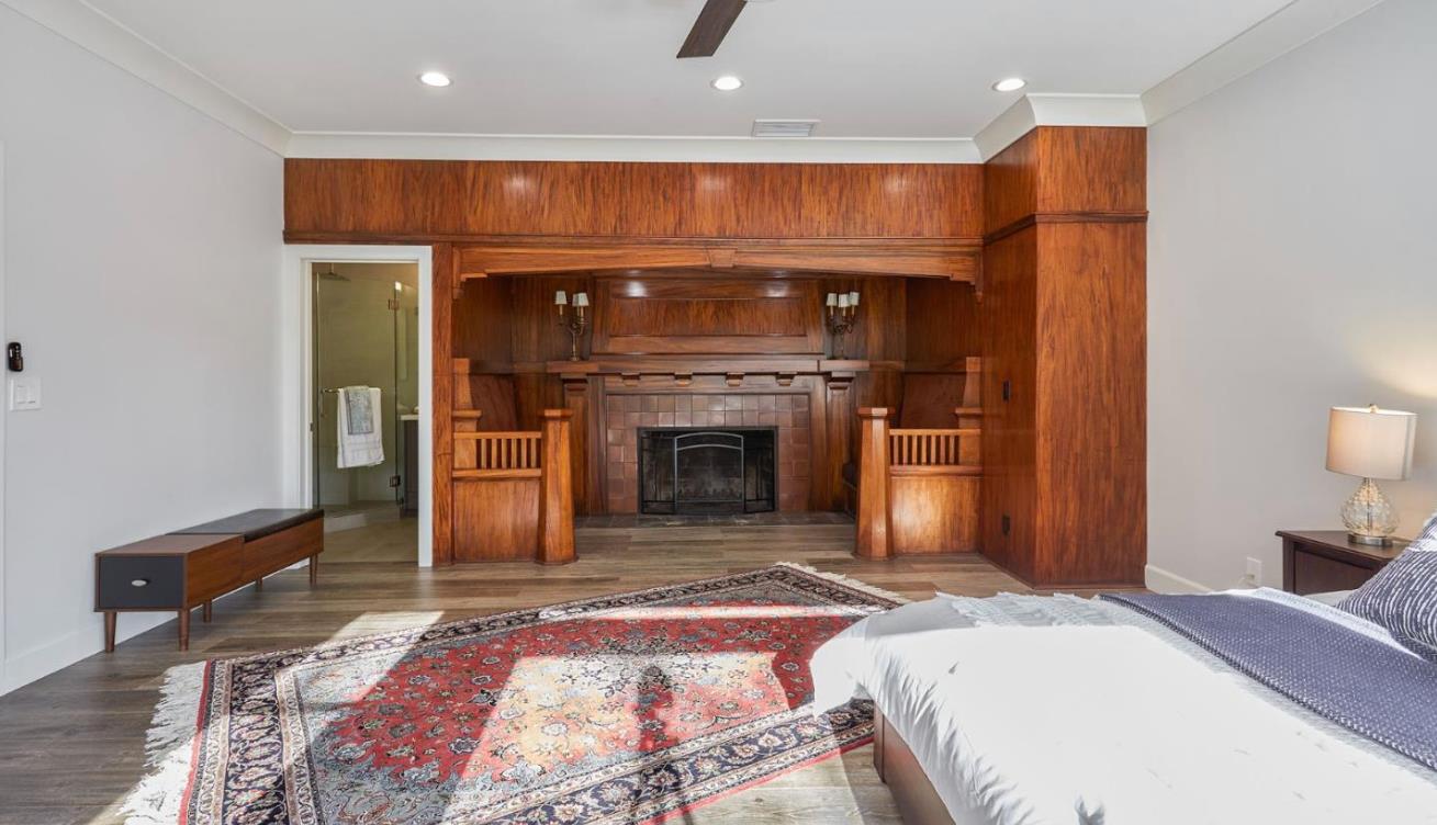 251 Middlefield Road Palo Alto, CA 94301 - Photo 23 of 76 a spacious bedroom with a bed and a fireplace