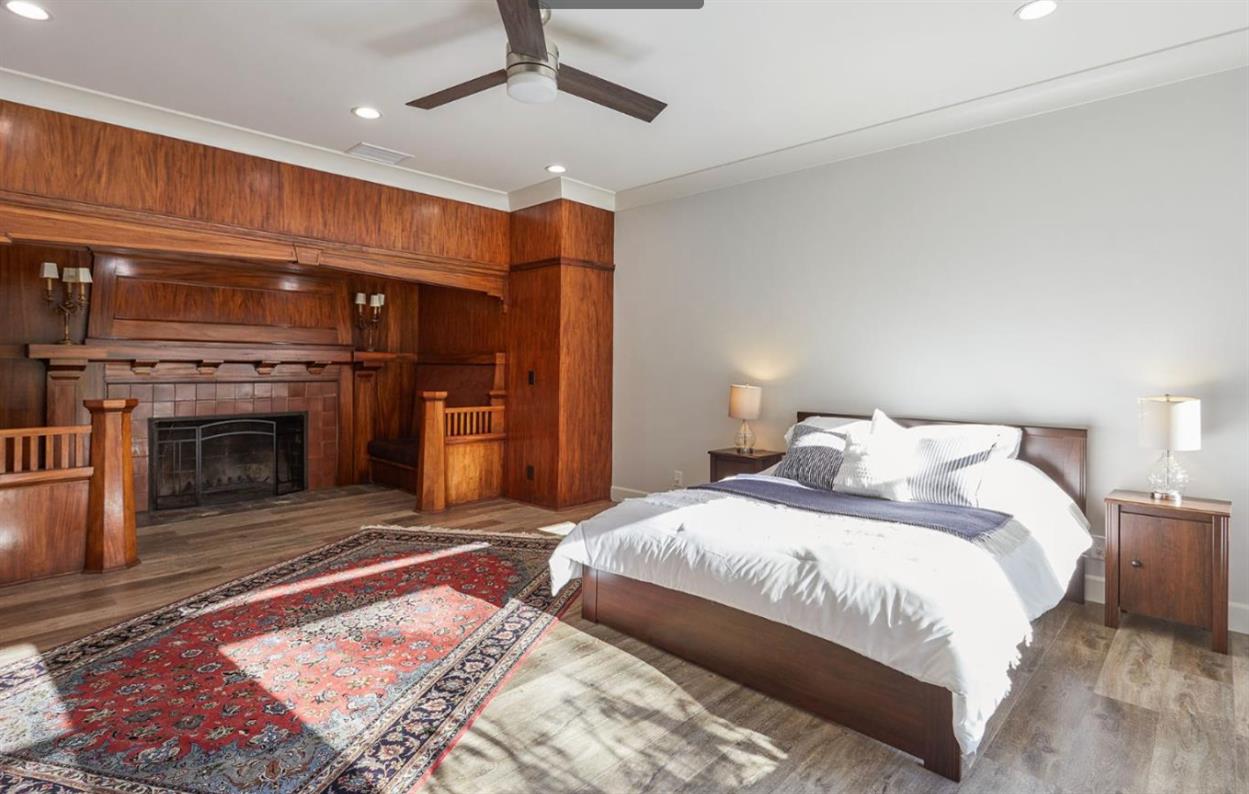 251 Middlefield Road Palo Alto, CA 94301 - Photo 24 of 76 a spacious bedroom with a bed and a fireplace