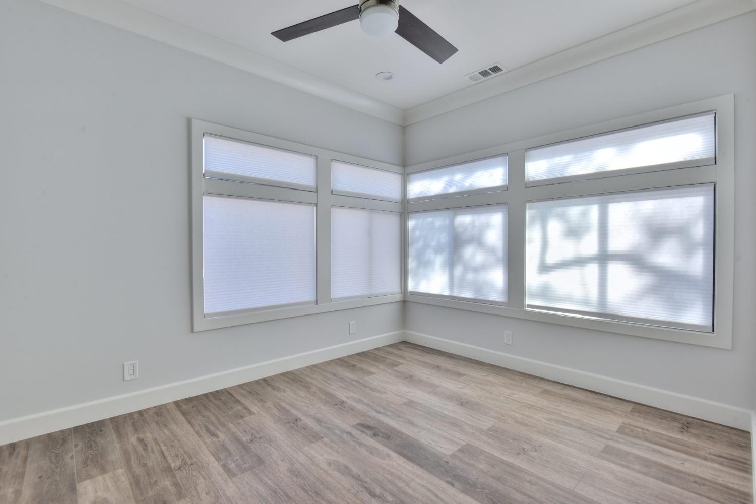 251 Middlefield Road Palo Alto, CA 94301 - Photo 31 of 76 an empty room with wooden floor and windows