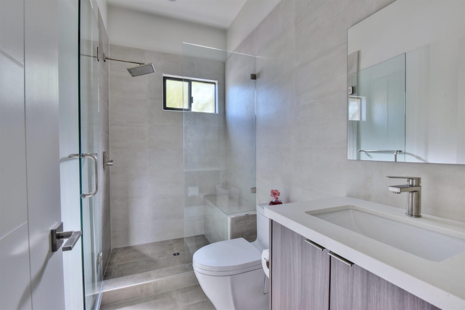 251 Middlefield Road Palo Alto, CA 94301 - Photo 35 of 76 a bathroom with a sink toilet vanity and shower