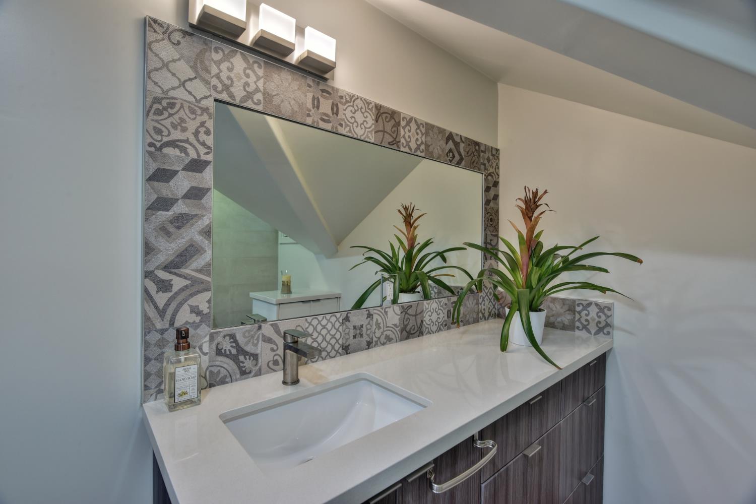 251 Middlefield Road Palo Alto, CA 94301 - Photo 41 of 76 a bathroom with a sink and a mirror