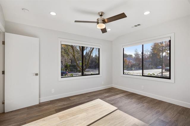 251 Middlefield Road Palo Alto, CA 94301 - Photo 42 of 76 a view of an empty room with wooden floor and a window