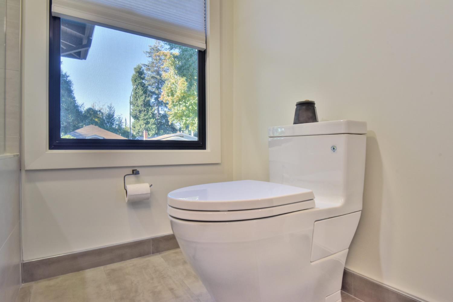 251 Middlefield Road Palo Alto, CA 94301 - Photo 43 of 76 a white toilet sitting next to a bathroom sink