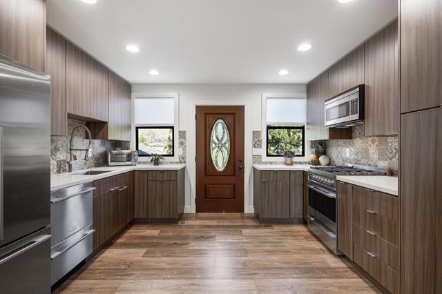 251 Middlefield Road Palo Alto, CA 94301 - Photo 45 of 76 a kitchen with granite countertop stainless steel appliances and wooden cabinets