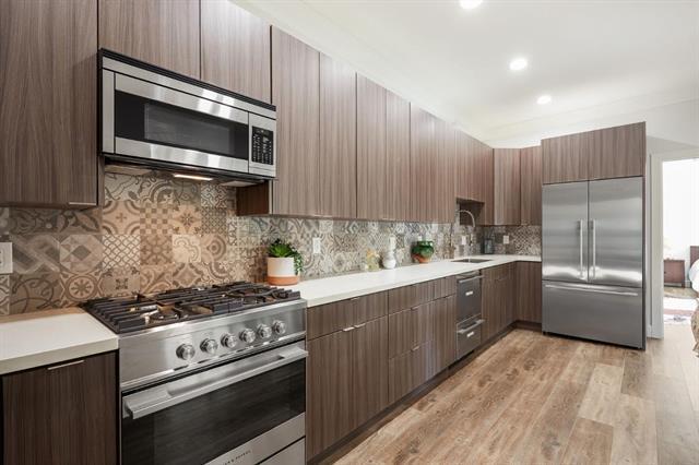 251 Middlefield Road Palo Alto, CA 94301 - Photo 49 of 76 a kitchen with stainless steel appliances a stove a sink and a microwave