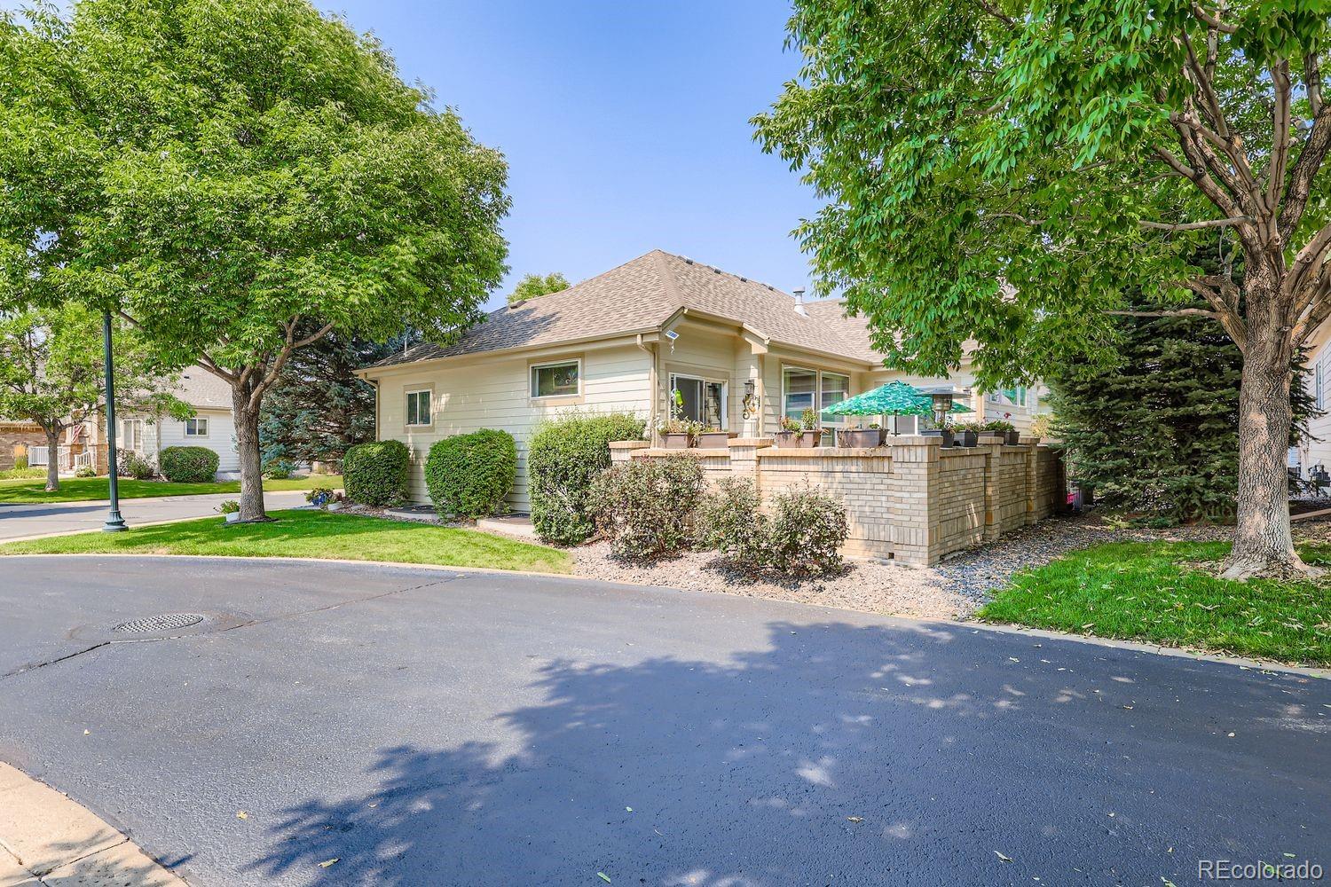 10752 Zuni Drive Denver, CO 80234 - Photo 27 of 27 a front view of a house with a yard and garage
