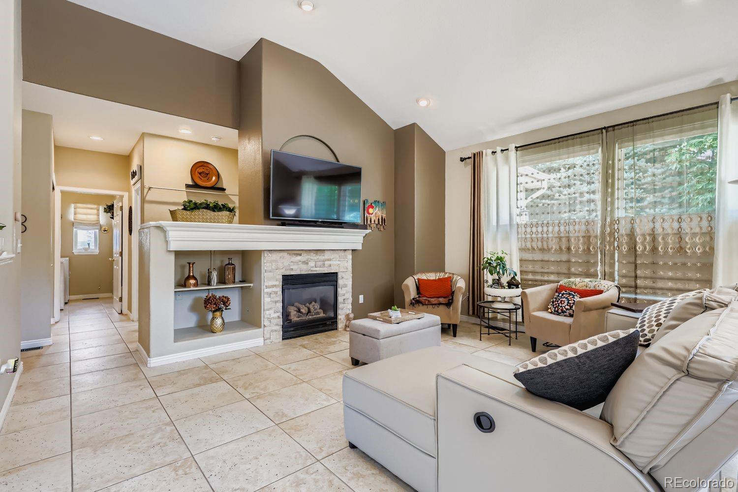 10752 Zuni Drive Denver, CO 80234 - Photo 5 of 27 a living room with furniture and fireplace