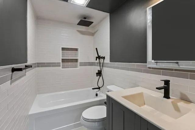 a bathroom with a sink a toilet and a bathtub