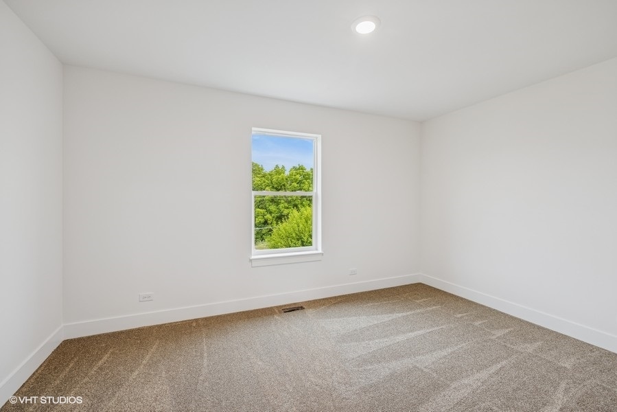 735 Fox Trail Terrace Cary, IL 60013 - Photo 12 of 21 an empty room with a window