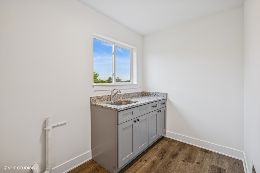 735 Fox Trail Terrace Cary, IL 60013 - Photo 13 of 21 a utility room with a sink washer and dryer