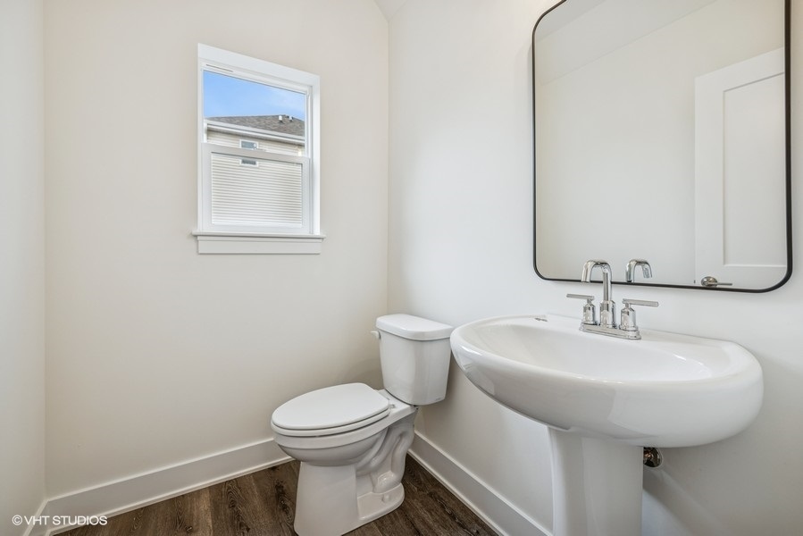 735 Fox Trail Terrace Cary, IL 60013 - Photo 4 of 21 a bathroom with a sink toilet and mirror
