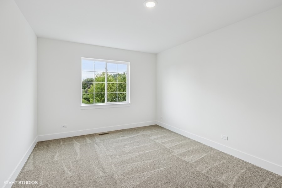 735 Fox Trail Terrace Cary, IL 60013 - Photo 9 of 21 an empty room with a window