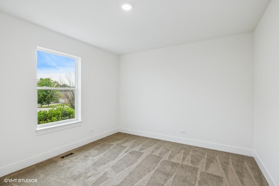 735 Fox Trail Terrace Cary, IL 60013 - Photo 10 of 21 an empty room with a window