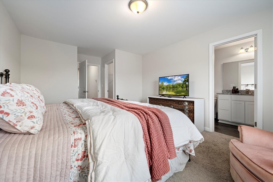 117 Adger Road Pendleton, SC 29670 - Photo 18 of 36 This serene bedroom offers a private retreat with seamless access to its dedicated bathroom.