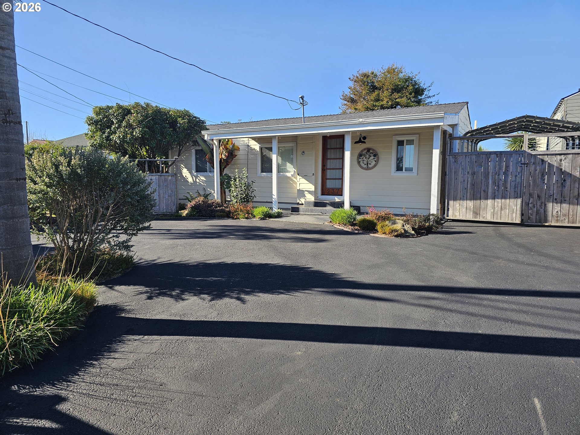 a front view of a house with sitting area